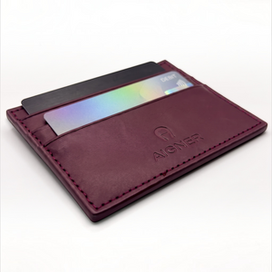 SUL EXTRAS burgundy leather cardholder with Aigner logo, featuring hand-stitched edges and multiple card slots.