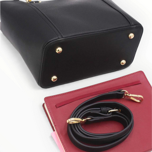 SUL EXTRAS Tom & Eva Camille black structured handbag with gold hardware, metal feet, and detachable shoulder strap