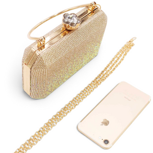 SUL EXTRAS Odette evening bag in gold with rhinestone embellishments, arched handle, and detachable metal chain strap.