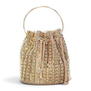 SUL EXTRAS Tom & Eva gold rhinestone bucket bag with a circular metal handle and geometric embellishments.