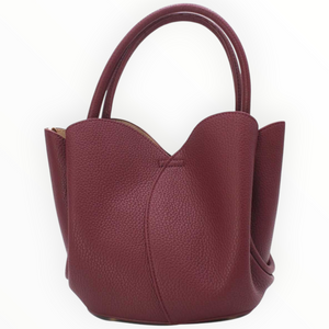 SUL EXTRAS Tom & Eva Tulipe 2-in-1 burgundy grained synthetic tote bag with petal-inspired curves and top handles.