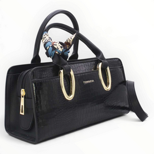 SUL EXTRAS Tom & Eva Amélie black croc-effect handbag with gold-tone oval handles and a decorative patterned scarf.