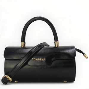 SUL EXTRAS Tom & Eva Colette black patent-effect barrel handbag with gold-tone hardware and top handle.
