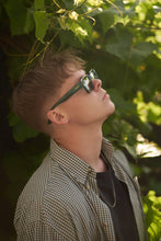 Load image into Gallery viewer, Durable Sefsan Evolution sunglasses with teal frame with transparent green lenses, 100% UV protection lenses, modern unisex type, premium style and comfortable fit model side view