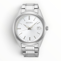 SUL EXTRAS Seiko Essentials Classic men's watch with a silver sunray dial, stainless steel bracelet, and date display.