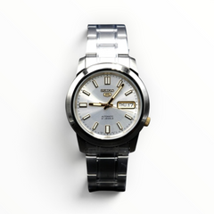 SUL EXTRAS Seiko 5 automatic watch with a silver dial, stainless steel band, and gold-tone accents