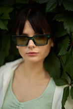 Load image into Gallery viewer, Unisex Sefsan Evolution sunglasses featuring durable green tortoise frame, UV-protected transparent green lens, and contemporary design for men and women front view