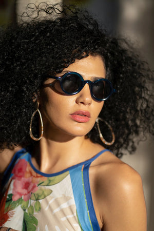 Sefsan Sphaira sunglasses with transparent blue frame and smoke lenses, unisex modern design, lightweight and stylish for everyday wear model front view