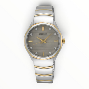 SUL EXTRAS Seiko Classic ladies' watch with a grey textured dial, diamond markers, and two-tone stainless steel band.