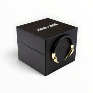 SUL EXTRAS Roberto Cavalli watch gift box in matte black with a signature gold jaguar claw closure and rubber handle.