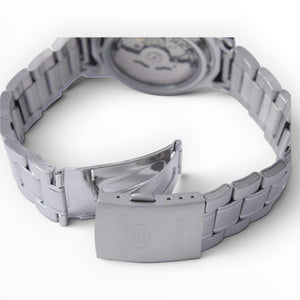SUL EXTRAS Seiko 5 automatic watch showing the stainless steel bracelet, deployment clasp, and exhibition caseback.