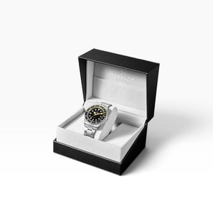SUL EXTRAS Tornado Lumina Date watch with matte black dial and olive-black GMT bezel in a luxury black gift box.