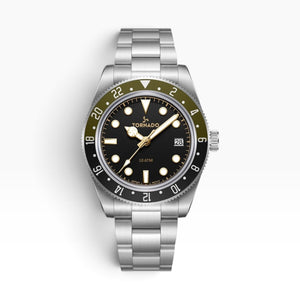 SUL EXTRAS Tornado Lumina Date watch with matte black dial, olive and black GMT bezel, and brushed stainless steel band.