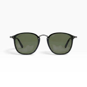 SUL EXTRAS Visi sunglasses featuring a shiny black rectangle frame and green lenses with metal stud detailing.