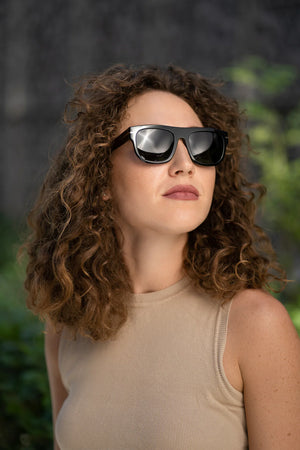 Sefsan Nehsan unisex sunglasses featuring wide square frame, flat top bar, smoke lenses, and bold contemporary aesthetic modewl side view