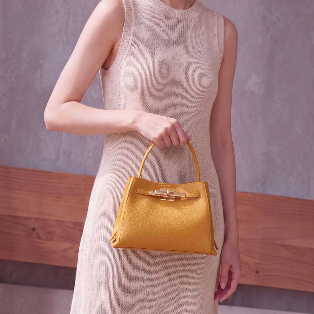 SUL EXTRAS Adèle shoulder bag in mustard yellow grained synthetic leather with gold-tone hardware and belt detail