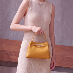 SUL EXTRAS Adèle shoulder bag in mustard yellow grained synthetic leather with gold-tone hardware and belt detail