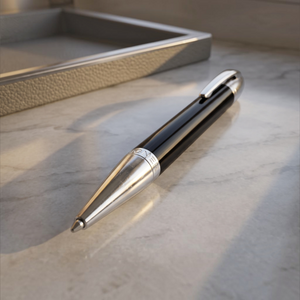 SUL EXTRAS Aigner Original Executive ballpoint pen in gloss black lacquer and polished stainless steel on marble.