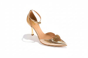Gold high-heeled shoe with a stiletto heel on a white background