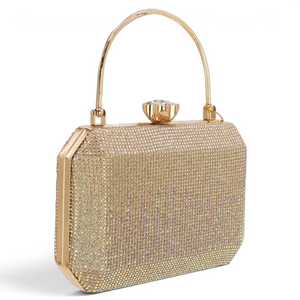 SUL EXTRAS Odette evening bag in gold with shimmering rhinestone detailing, arched top handle, and floral clasp.