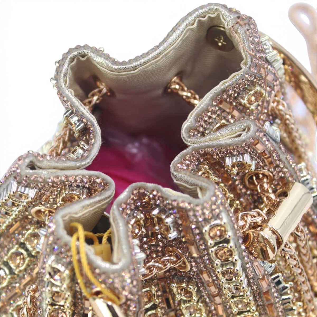 SUL EXTRAS Étoile evening bucket bag featuring shimmering geometric rhinestones and a gathered synthetic design.