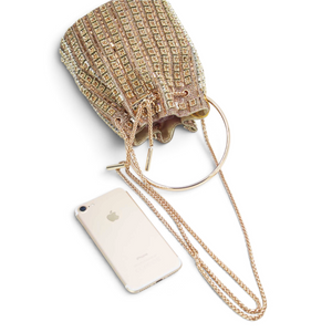 SUL EXTRAS Étoile evening bucket bag in gold with geometric rhinestones, circular handle, and chain shoulder strap.