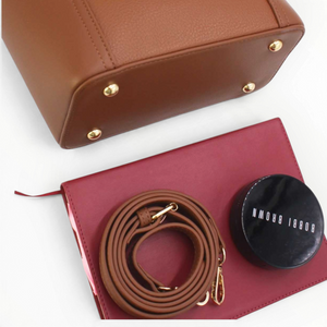 SUL EXTRAS Tom & Eva Camille tan structured handbag with gold hardware, detachable strap, and protective metal feet