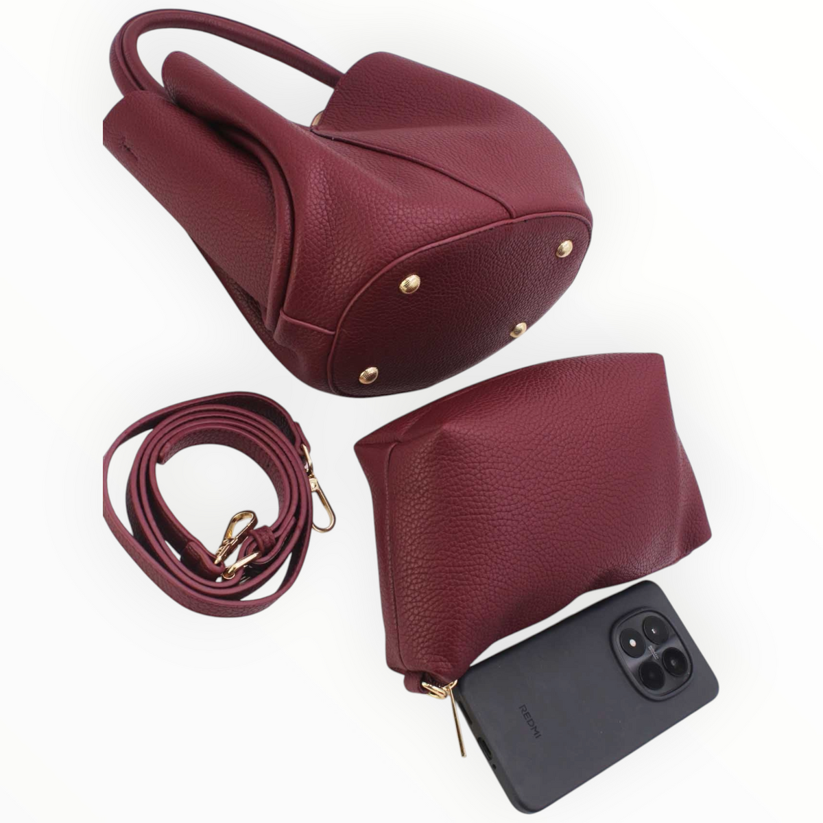 SUL EXTRAS burgundy grained synthetic 2-in-1 tote bag with removable pouch, shoulder strap, and gold-tone feet.