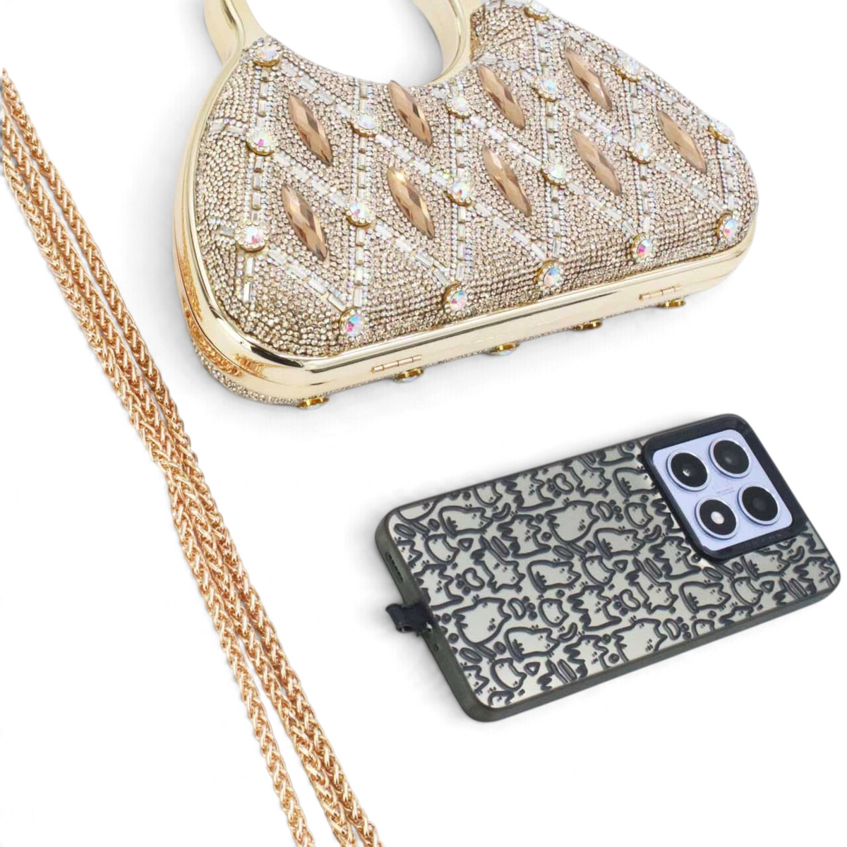 SUL EXTRAS Aurelia evening bag with gold rhinestone latticework, circular handles, and a detachable chain strap.