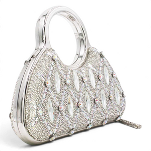 SUL EXTRAS Aurelia evening bag featuring silver rhinestone latticework, faceted embellishments, and circular top handles.