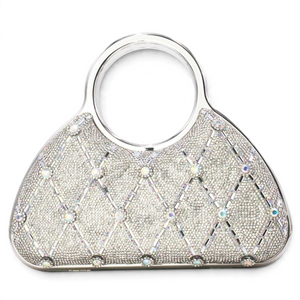 SUL EXTRAS Aurelia evening bag with silver rhinestone latticework, circular top handles, and faceted embellishments.