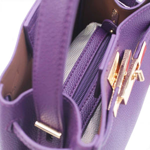 SUL EXTRAS Adèle shoulder bag in purple grained synthetic material with gold-tone hardware and removable inner pouch.