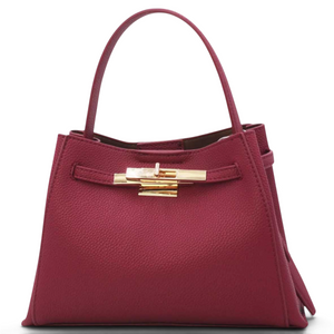 SUL EXTRAS Adèle shoulder bag in burgundy grained synthetic leather with gold-tone hardware and belt detail.