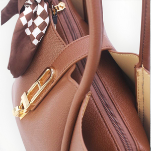 SUL EXTRAS Vivienne brown grained synthetic trapeze handbag with gold-tone turn-lock and decorative patterned scarf
