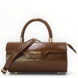 SUL EXTRAS Tom & Eva Colette brown patent-effect barrel handbag with gold-tone hardware and top handle