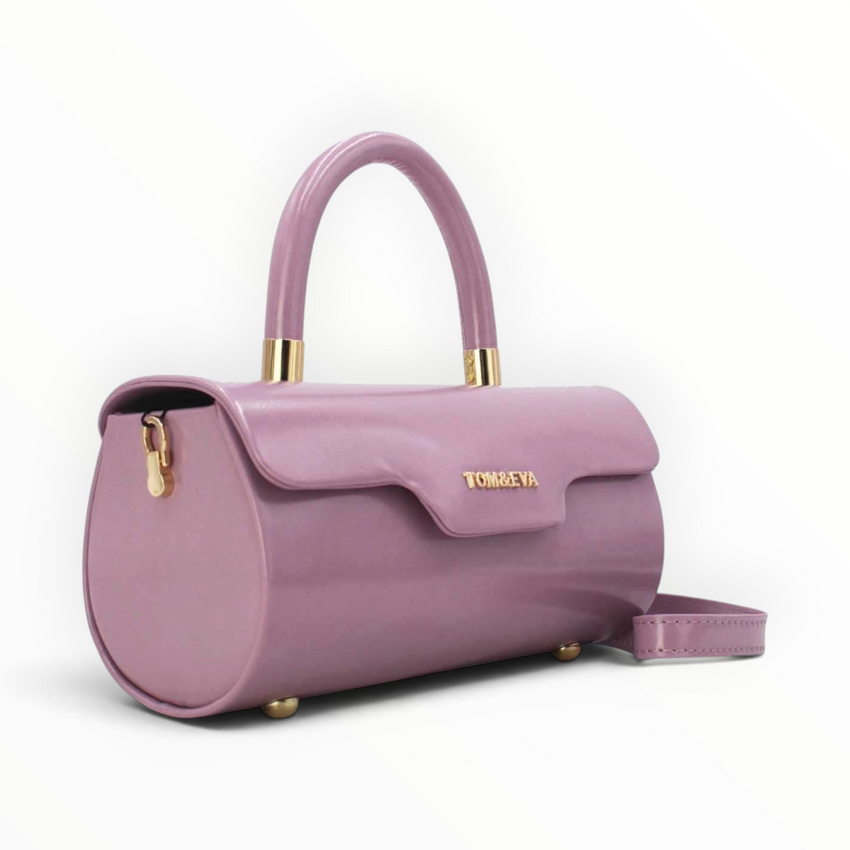 SUL EXTRAS Tom & Eva mauve patent barrel handbag with gold-tone hardware, top handle, and magnetic flap closure.