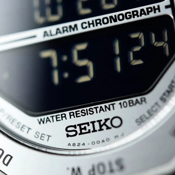 SUL EXTRAS Seiko Rotocall digital watch face with reverse display and stainless steel case detail