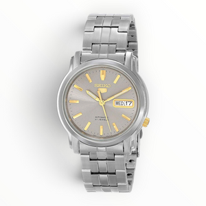 SUL EXTRAS Seiko 5 automatic watch with grey dial, gold-tone hands, and silver-tone stainless steel bracelet.
