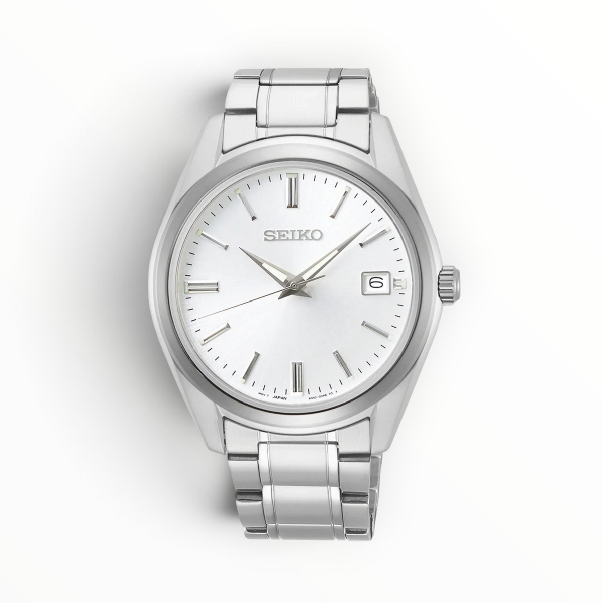 SUL EXTRAS Seiko Essentials Classic men's watch with a silver sunray dial, stainless steel bracelet, and date window.