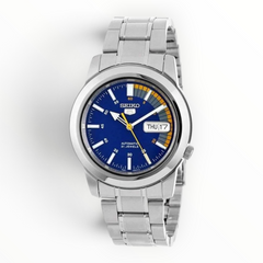 SUL EXTRAS Seiko 5 Speed Racer automatic watch with blue dial, yellow accents, and silver-tone stainless steel band.