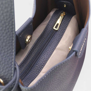 SUL EXTRAS Tom & Eva Noémie bucket bag interior view showing the removable zipped pouch and patterned lining