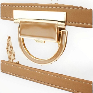 Close-up of the gold-tone metal clasp on a tan Tom & Eva Riviera shoulder bag by SUL EXTRAS