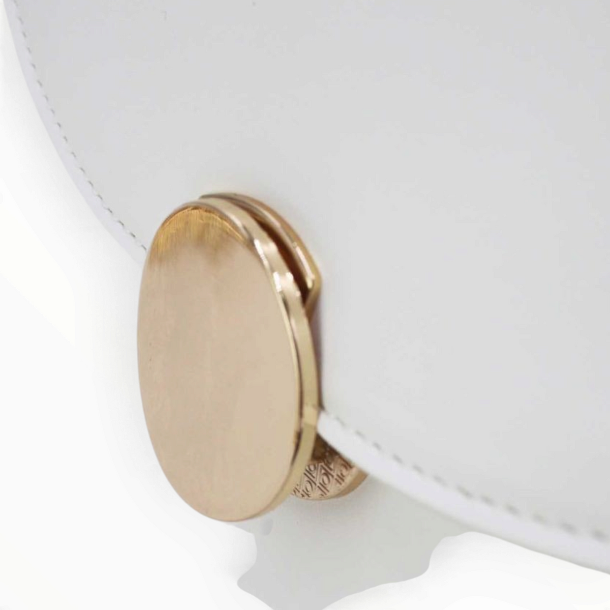 SUL EXTRAS Tom & Eva white synthetic handbag featuring a minimalist curved flap and a circular gold-tone accent