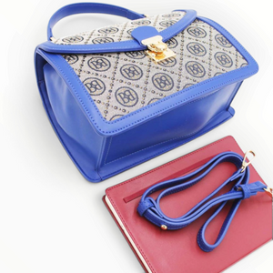 SUL EXTRAS Tom & Eva vintage-inspired monogram handbag in blue with gold turn-lock closure and detachable strap