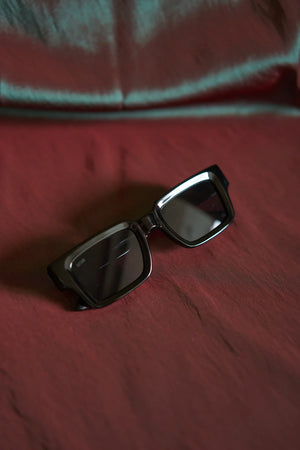 Sefsan Evolution black frame sunglasses with black tinted lenses, lightweight design, and versatile style for casual and outdoor use