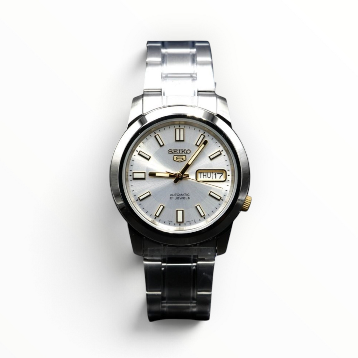 SUL EXTRAS Seiko 5 automatic watch with a silver dial, stainless steel band, and gold-tone accents