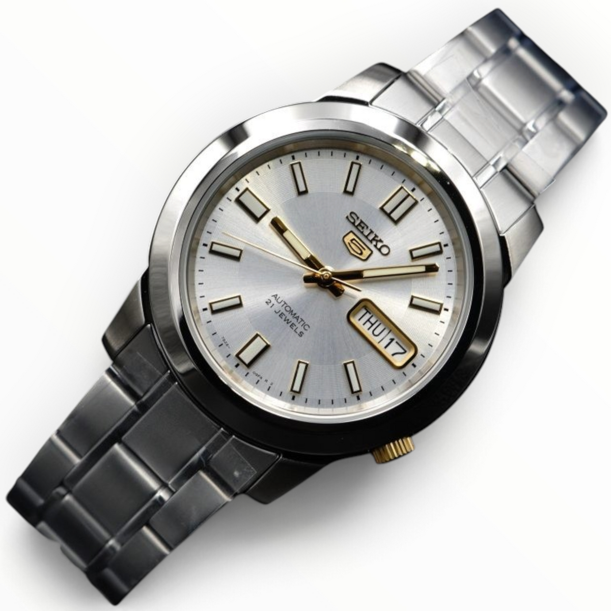 SUL EXTRAS Seiko 5 automatic watch with a silver dial, gold hands, and stainless steel bracelet