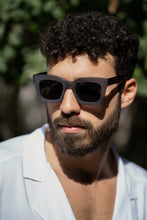 تحميل الصورة إلى عارض المعرض، Unisex Sefsan Crimpy dolphin grey frame sunglasses with tinted lenses, sleek contemporary design, and comfortable fit for everyday wear model side view 
