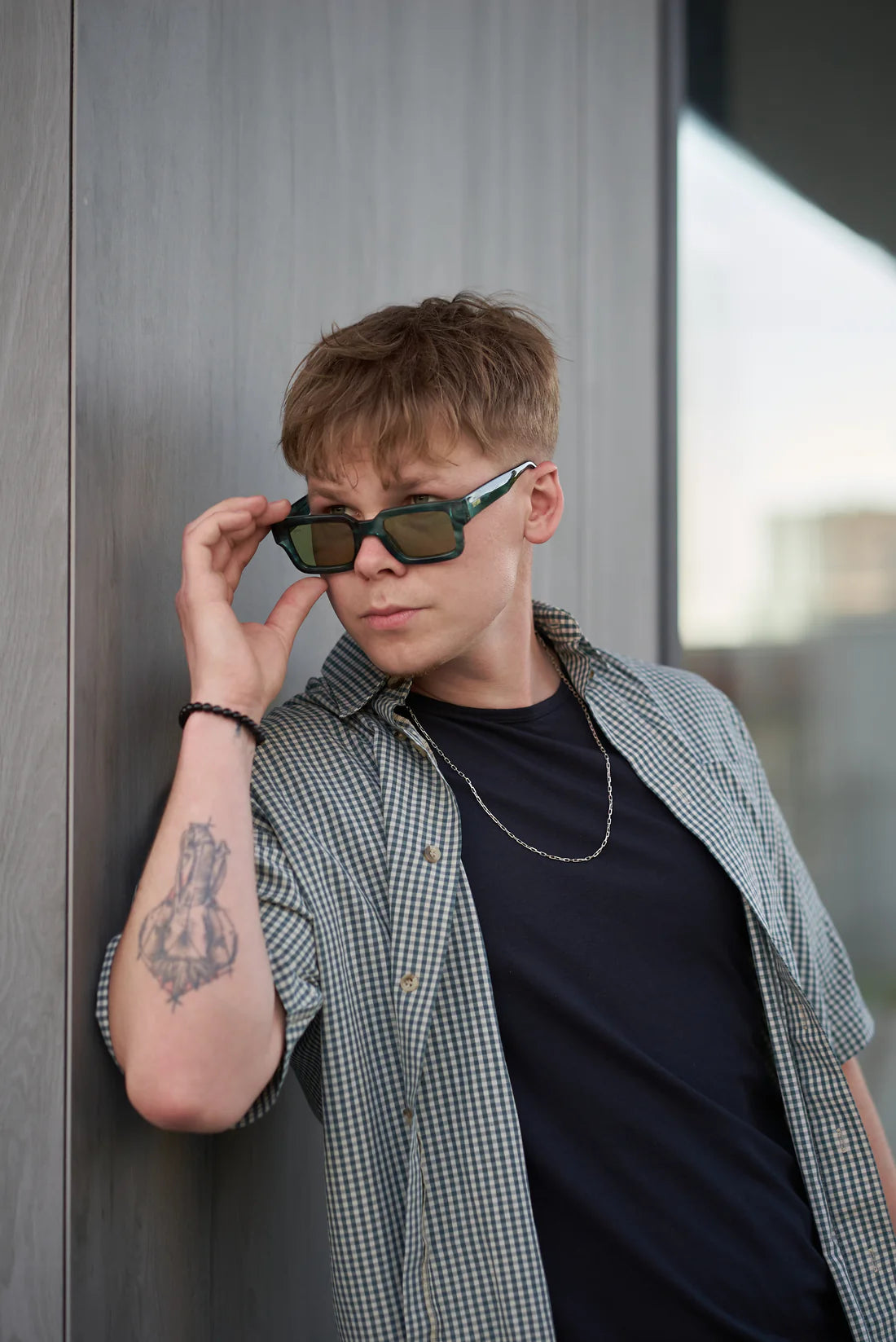 Durable Sefsan Evolution sunglasses with teal frame with transparent green lenses, 100% UV protection lenses, modern unisex type, premium style and comfortable fit model view 