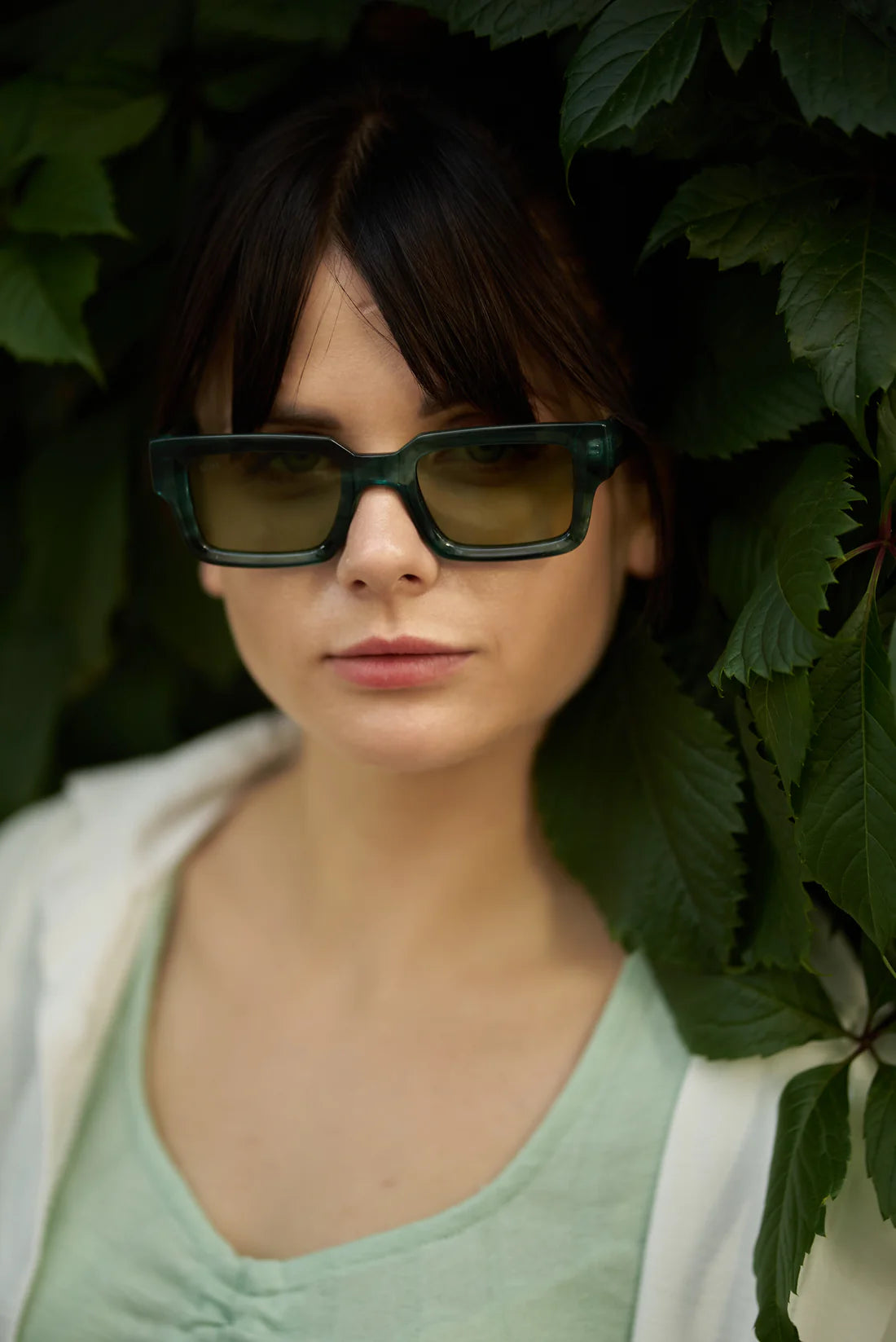 Unisex Sefsan Evolution sunglasses featuring durable green tortoise frame, UV-protected transparent green lens, and contemporary design for men and women front view 